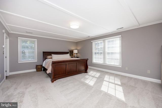 carpeted bedroom featuring crown molding and multiple windows