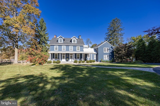 view of front facade with a porch and a front yard