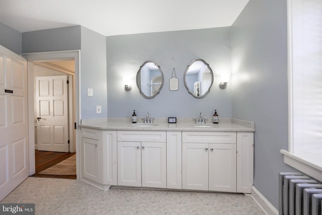 bathroom with vanity and radiator heating unit