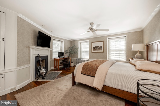 bedroom featuring ceiling fan, crown molding, and dark hardwood / wood-style floors