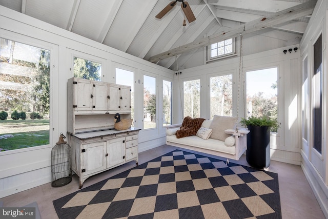 sunroom featuring lofted ceiling with beams and ceiling fan