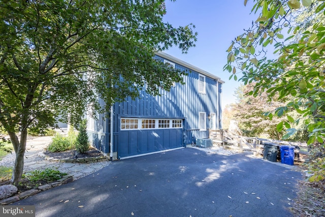 view of property exterior with a garage