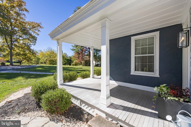 wooden deck with a yard