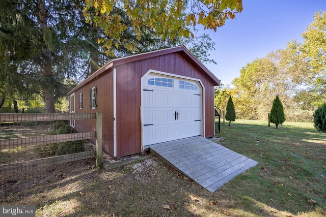 garage featuring a lawn