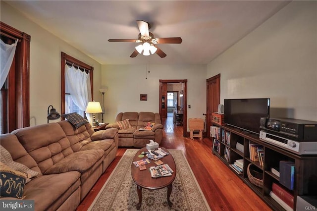 living room with hardwood / wood-style flooring and ceiling fan