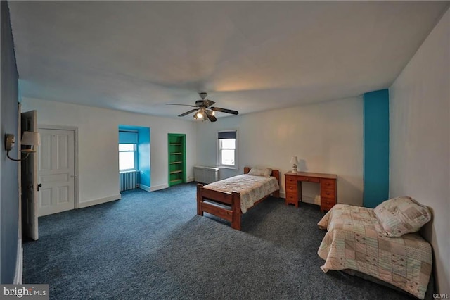 carpeted bedroom featuring radiator heating unit and ceiling fan