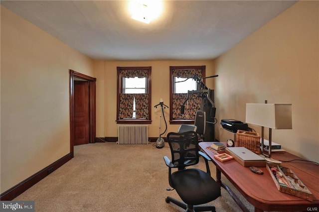 carpeted home office with radiator