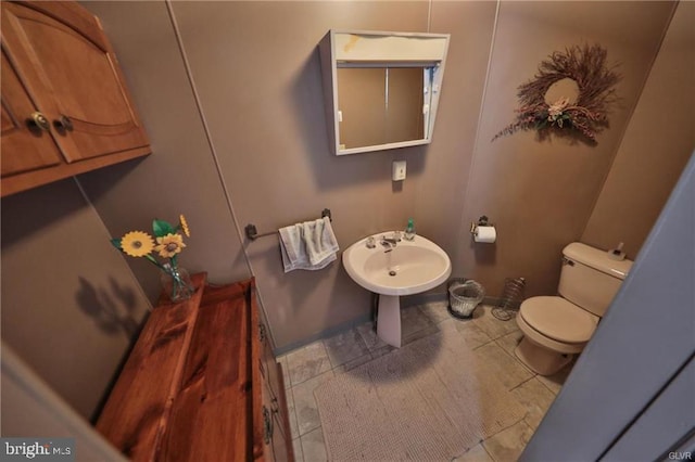 bathroom featuring tile patterned floors and toilet