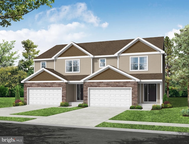 craftsman-style house featuring a front yard and a garage