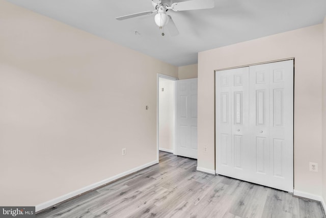 unfurnished bedroom featuring light wood-type flooring, a closet, and ceiling fan