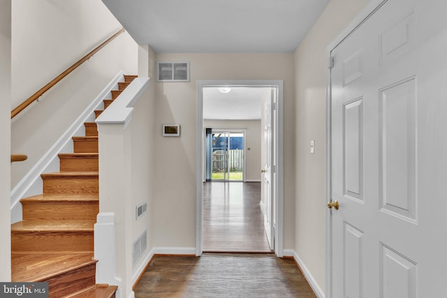 entrance foyer with dark hardwood / wood-style floors