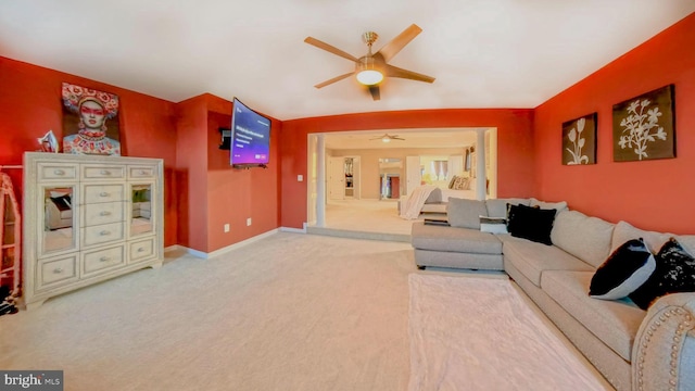 living room featuring ceiling fan and carpet flooring