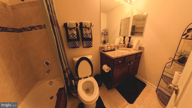 full bathroom featuring toilet, shower / bath combination with curtain, vanity, and tile patterned flooring