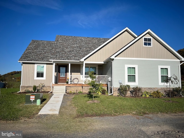 view of front of home featuring a front lawn and a porch