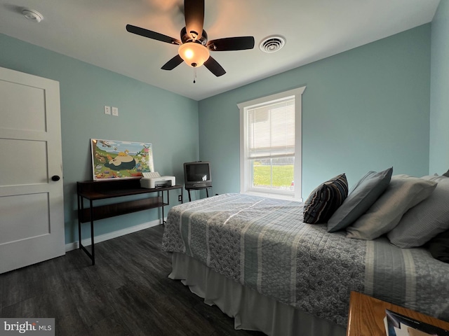 bedroom featuring dark wood-type flooring and ceiling fan