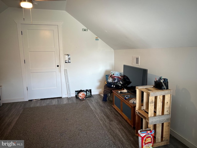 bonus room featuring lofted ceiling and dark hardwood / wood-style floors