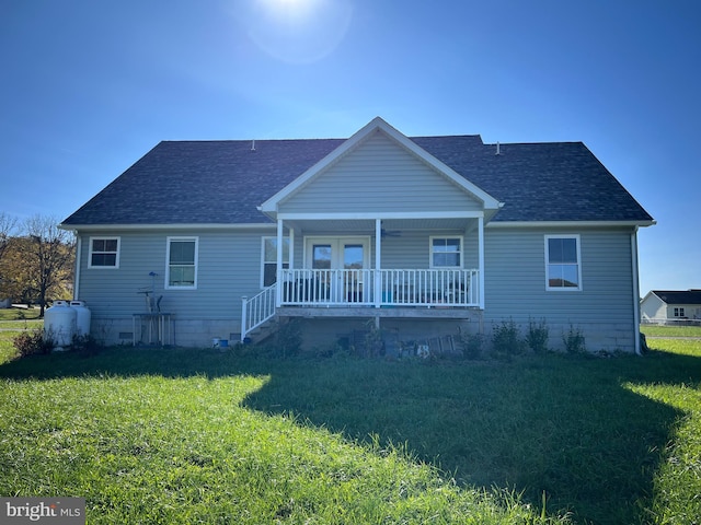 exterior space featuring a front lawn and covered porch