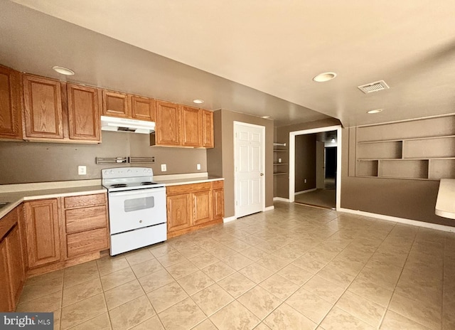 kitchen with electric stove and light tile patterned floors