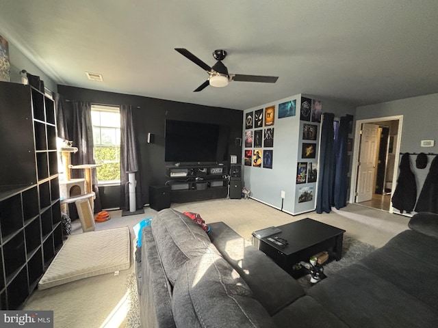 living room with ceiling fan and carpet floors