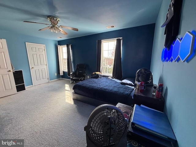 carpeted bedroom featuring ceiling fan