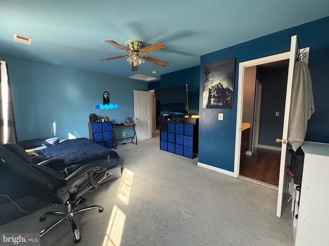 bedroom featuring carpet flooring, connected bathroom, and ceiling fan