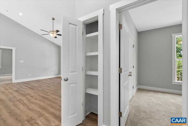 hall featuring wood-type flooring and built in features