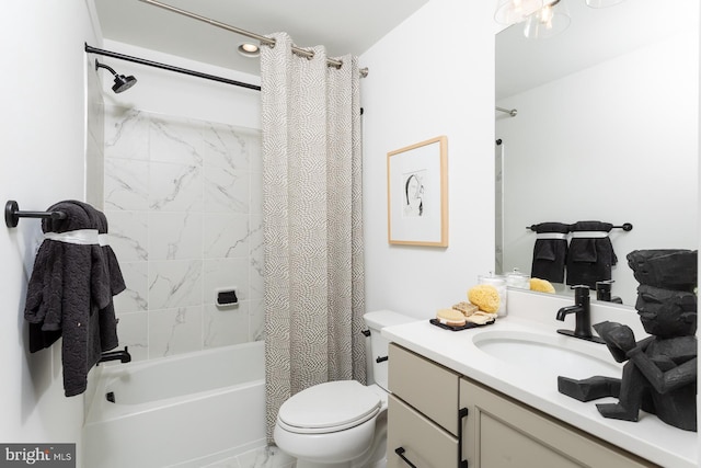 full bathroom with vanity, shower / bath combo, and toilet