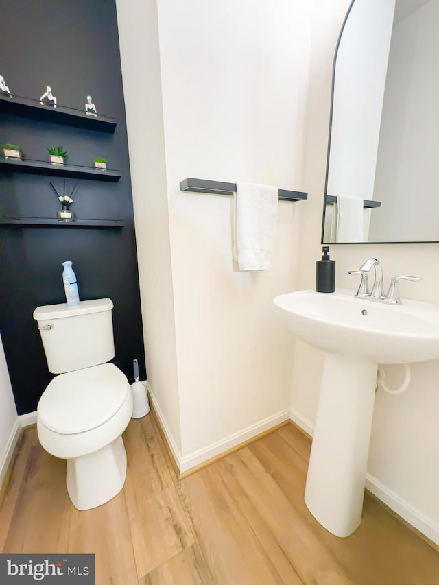 bathroom featuring toilet and hardwood / wood-style floors