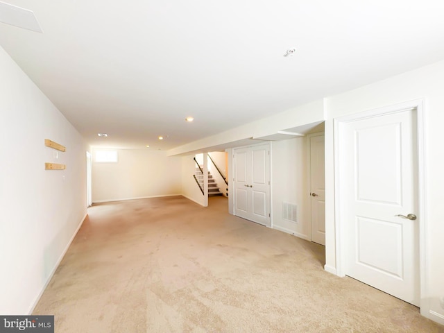 basement with light colored carpet