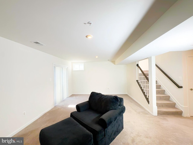 living room featuring light carpet