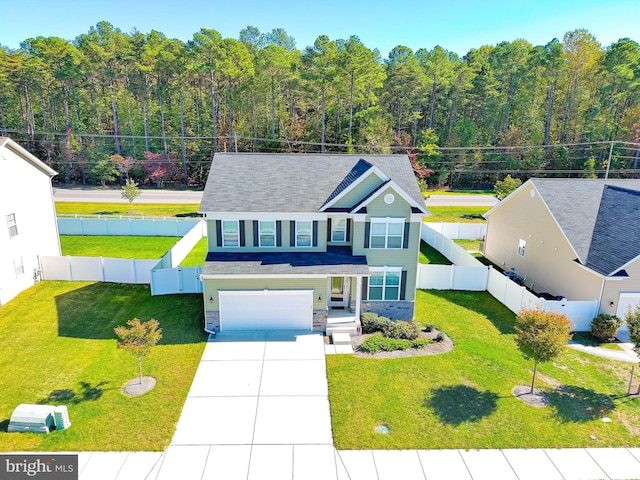 view of front of home featuring a garage and a front lawn