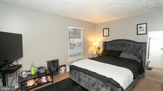 carpeted bedroom with a textured ceiling