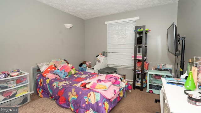 bedroom with a textured ceiling and carpet floors