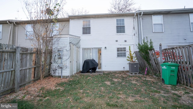 rear view of property with central air condition unit