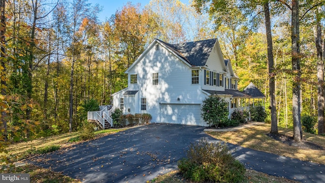 view of side of home with a garage