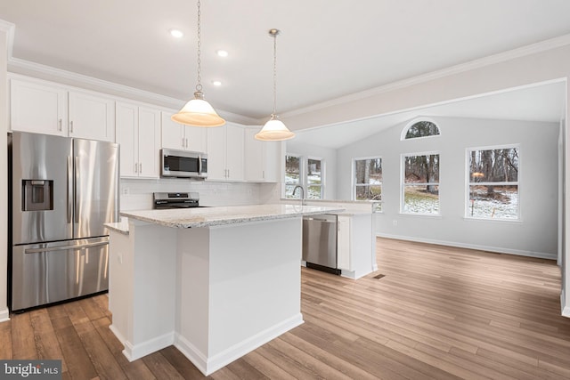 kitchen featuring appliances with stainless steel finishes, light hardwood / wood-style flooring, and white cabinets