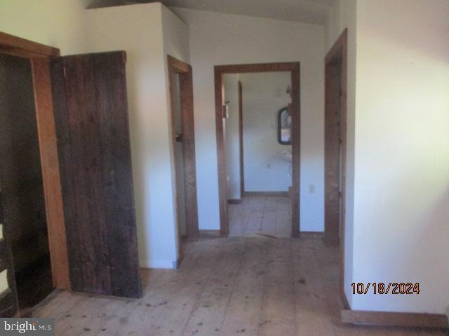 hallway with light wood-type flooring