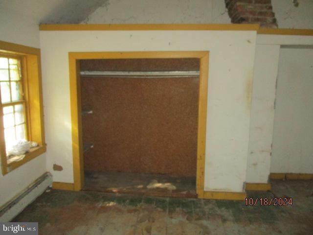 interior space featuring baseboard heating