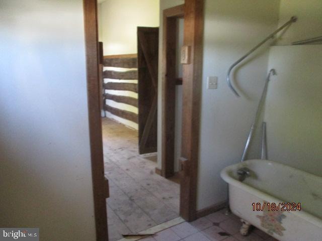 bathroom with a washtub