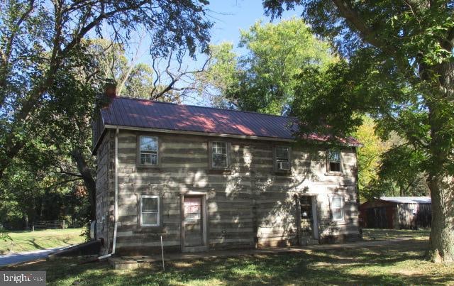 view of outbuilding with a lawn