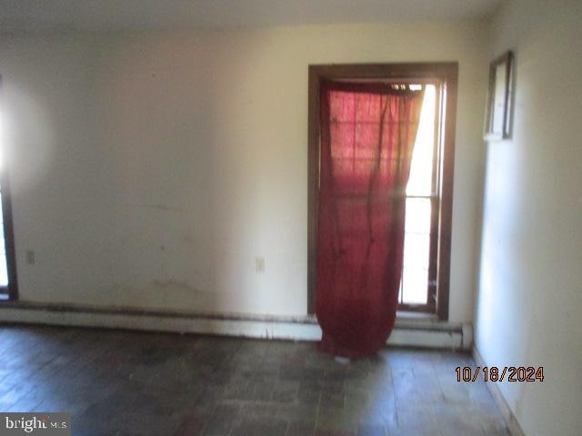 spare room featuring dark hardwood / wood-style flooring