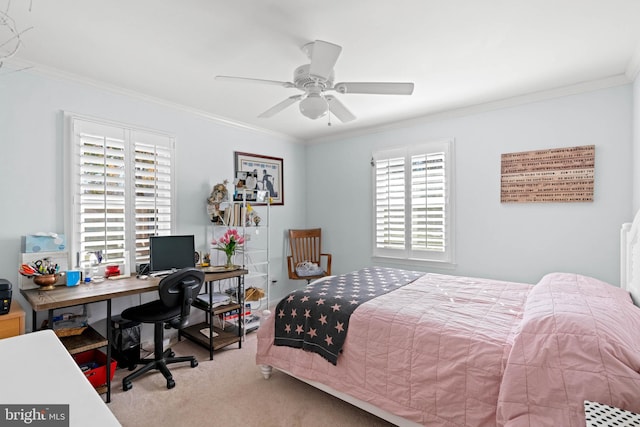 carpeted bedroom with ceiling fan and ornamental molding