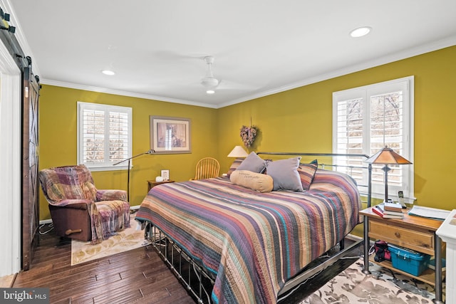 bedroom with multiple windows, ceiling fan, hardwood / wood-style floors, and ornamental molding