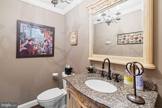 bathroom featuring crown molding, vanity, and toilet