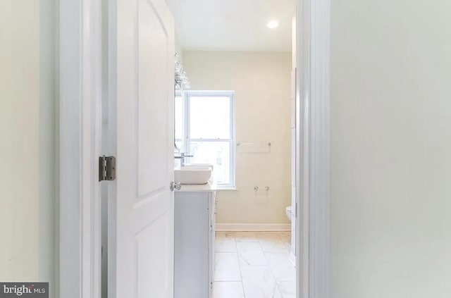 bathroom featuring toilet and vanity