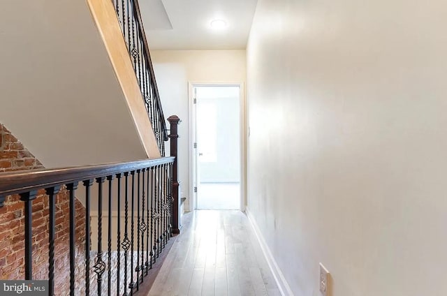 corridor featuring hardwood / wood-style floors