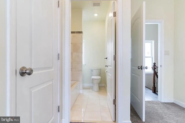 bathroom featuring separate shower and tub, toilet, and tile patterned flooring