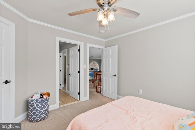 bedroom featuring ornamental molding, light carpet, and ceiling fan