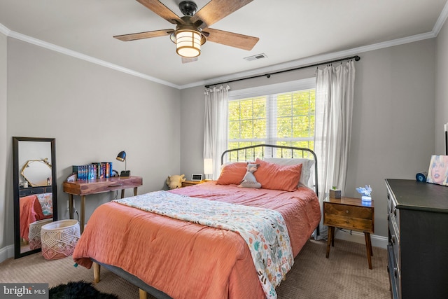 bedroom with ornamental molding, carpet, and ceiling fan