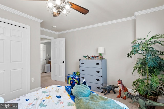 bedroom featuring crown molding, light colored carpet, and ceiling fan